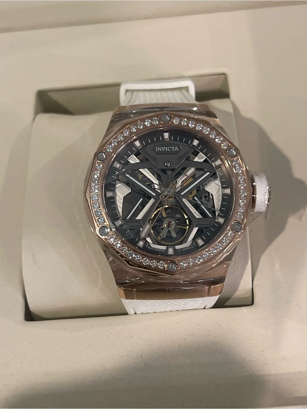 Invicta Rose Gold Skeleton Dial Watch with White Silicone Band and Crystal Bezel